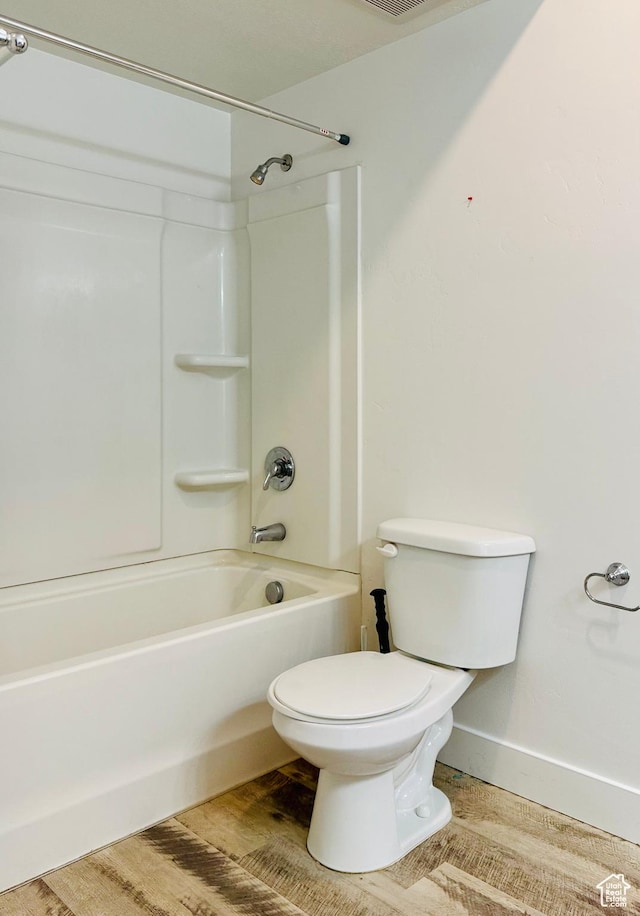 875 S Depot St Unit C211, Clearfield, UT 84015 - bathroom with toilet, washtub / shower combination, and baseboards
