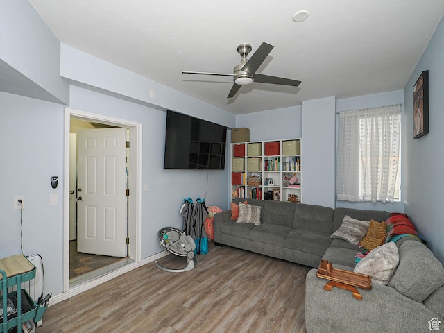 1631 W 50 N, Pleasant Grove, UT 84062 - living area featuring wood finished floors, a ceiling fan, and baseboards