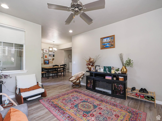 1631 W 50 N, Pleasant Grove, UT 84062 - living area featuring wood finished floors, baseboards, a ceiling fan, recessed lighting, and a chandelier