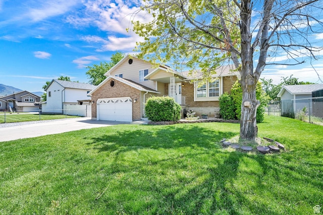 639 W 3750 S, Riverdale, UT 84405 - split level home featuring brick siding, concrete driveway, and a garage
