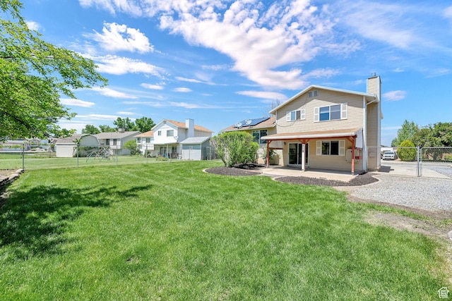 639 W 3750 S, Riverdale, UT 84405 - back of property with a patio area, a chimney, and a gate