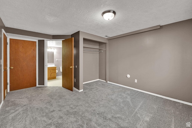 639 W 3750 S, Riverdale, UT 84405 - unfurnished bedroom with a textured ceiling, carpet, baseboards, and a closet