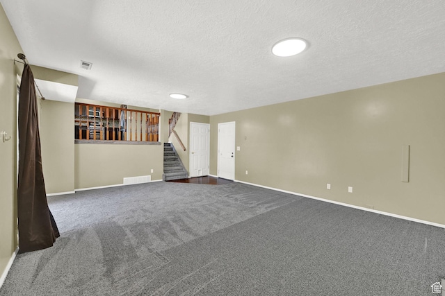 639 W 3750 S, Riverdale, UT 84405 - spare room featuring stairway, carpet flooring, a textured ceiling, and baseboards