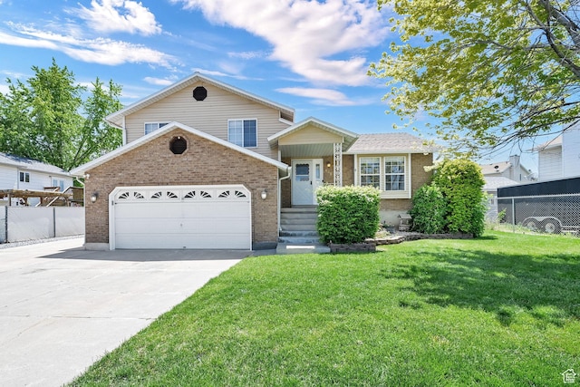 639 W 3750 S, Riverdale, UT 84405 - split level home featuring brick siding, driveway, and an attached garage