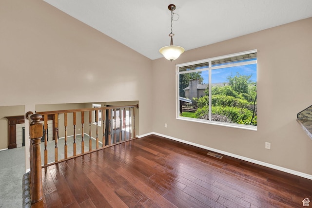 639 W 3750 S, Riverdale, UT 84405 - spare room with baseboards, hardwood / wood-style floors, healthy amount of natural light, and vaulted ceiling