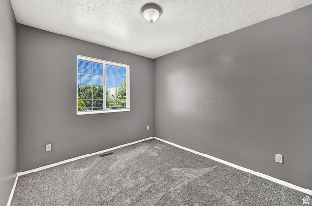 639 W 3750 S, Riverdale, UT 84405 - carpeted empty room with a textured ceiling and baseboards