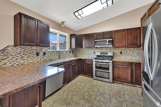 639 W 3750 S, Riverdale, UT 84405 - kitchen with stainless steel appliances, a sink, lofted ceiling, backsplash, and dark brown cabinetry