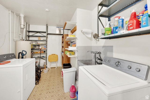4655 W 4715 S, Salt Lake City, UT 84118 - laundry area featuring water heater, light floors, and washer and clothes dryer