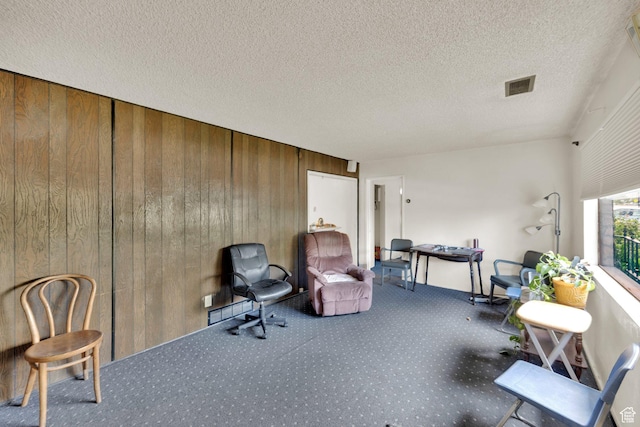4655 W 4715 S, Salt Lake City, UT 84118 - sitting room featuring wooden walls, carpet flooring, and a textured ceiling