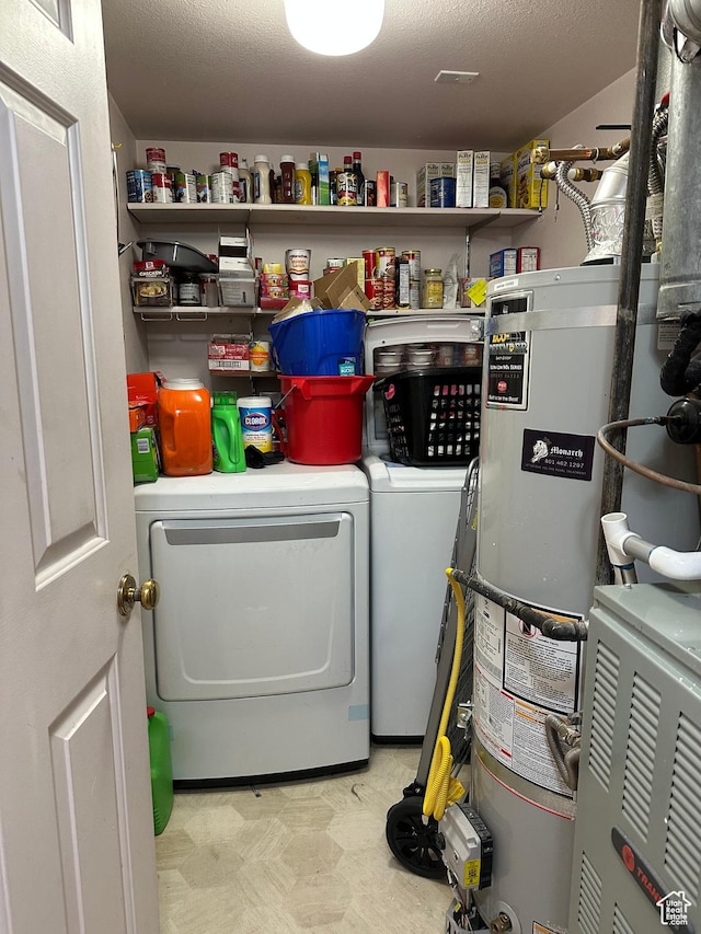 650 S Main St Unit 6104, Bountiful, UT 84010 - washroom featuring washing machine and dryer, light flooring, and gas water heater