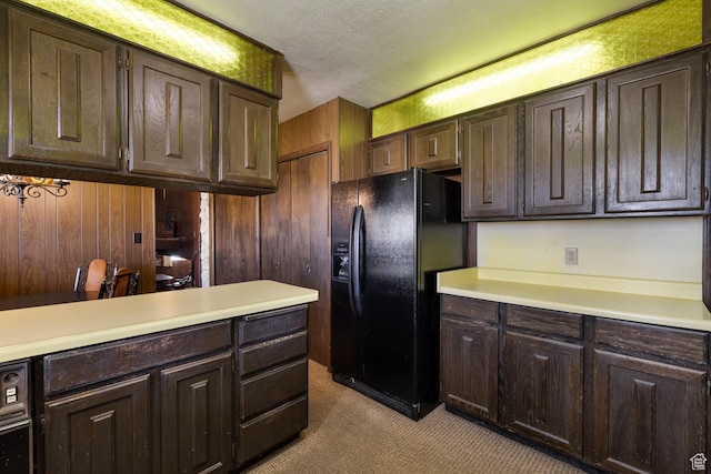 550 S 1500 W, Vernal, UT 84078 - kitchen featuring black fridge, light countertops, carpet flooring, dark brown cabinetry, and a textured ceiling