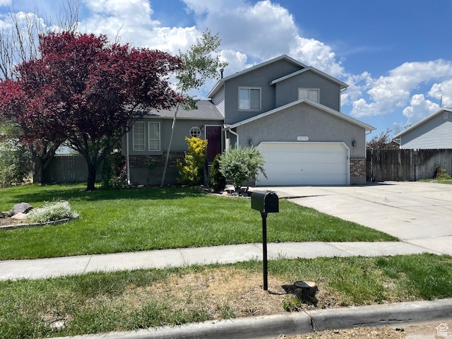 13778 S 2260 W, Riverton, UT 84065 - view of front of house with driveway, stucco siding, a garage, and brick siding
