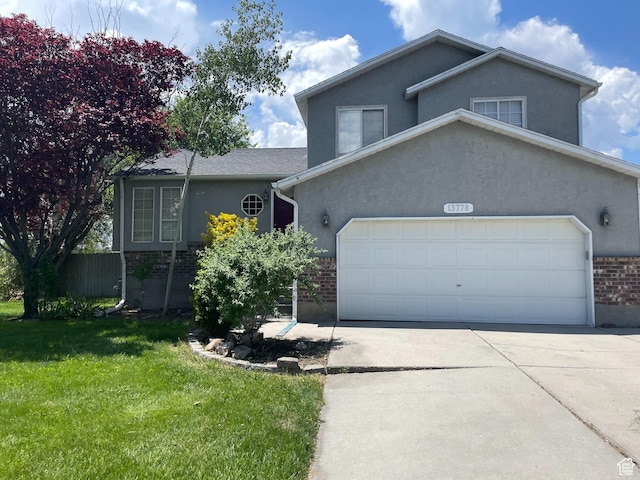 13778 S 2260 W, Riverton, UT 84065 - split level home featuring brick siding, an attached garage, a front yard, concrete driveway, and stucco siding
