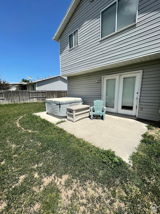 13778 S 2260 W, Riverton, UT 84065 - back of house with a hot tub and a patio