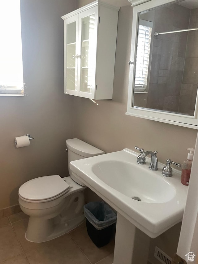13778 S 2260 W, Riverton, UT 84065 - full bath featuring toilet, plenty of natural light, tile patterned floors, and a tile shower