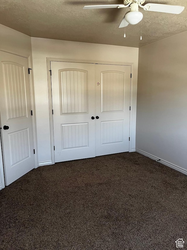 1126 W Lancelot Ln, West Haven, UT 84401 - unfurnished bedroom featuring dark carpet, baseboards, a closet, a ceiling fan, and a textured ceiling