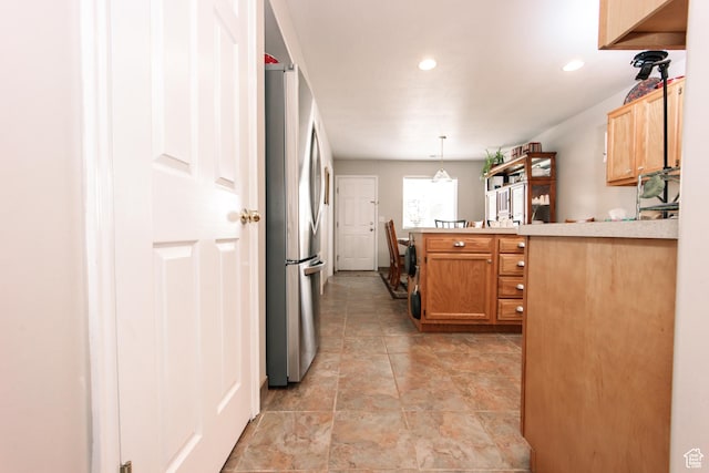 1969 N 275 W, Harrisville, UT 84414 - kitchen featuring freestanding refrigerator, light countertops, recessed lighting, hanging light fixtures, and a peninsula