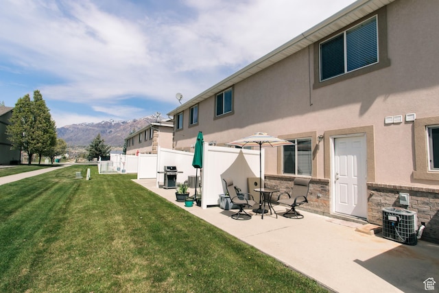 1969 N 275 W, Harrisville, UT 84414 - back of house with a mountain view, central AC, stucco siding, a patio, and stone siding