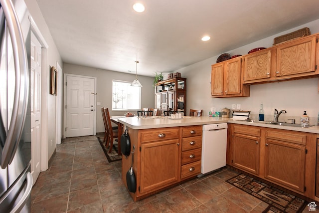 1969 N 275 W, Harrisville, UT 84414 - kitchen with a sink, freestanding refrigerator, white dishwasher, a peninsula, and light countertops