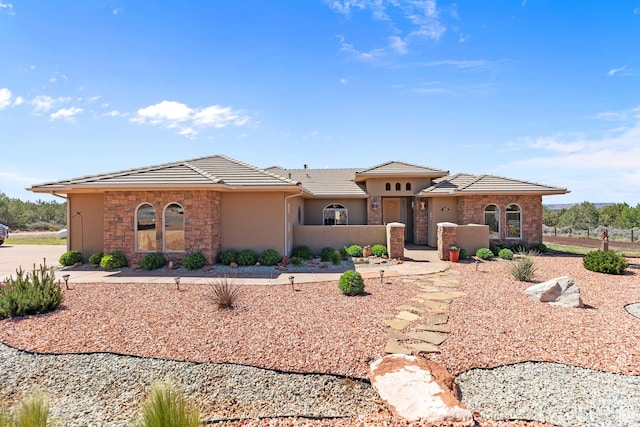 1374 E Big Pinion Ln, Apple Valley, UT 84737 - view of front of house with stone siding, stucco siding, and a tile roof