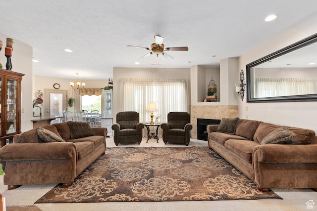 1374 E Big Pinion Ln, Apple Valley, UT 84737 - carpeted living area with a ceiling fan, a chandelier, a fireplace, and recessed lighting