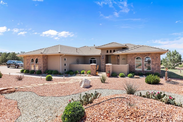 1374 E Big Pinion Ln, Apple Valley, UT 84737 - view of front facade with stone siding, a tile roof, and stucco siding