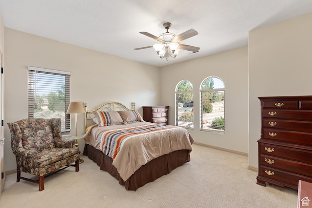 1374 E Big Pinion Ln, Apple Valley, UT 84737 - bedroom with multiple windows, light colored carpet, baseboards, and ceiling fan