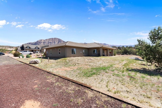 1374 E Big Pinion Ln, Apple Valley, UT 84737 - view of property exterior featuring a mountain view