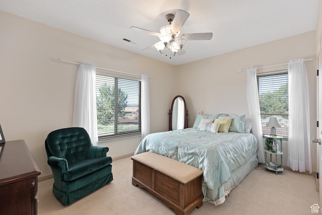 1374 E Big Pinion Ln, Apple Valley, UT 84737 - bedroom featuring multiple windows, light carpet, baseboards, and ceiling fan