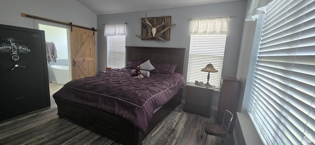 6897 S 4000 W, Benjamin, UT 84660 - bedroom featuring multiple windows, wood finished floors, a barn door, lofted ceiling, and ensuite bath