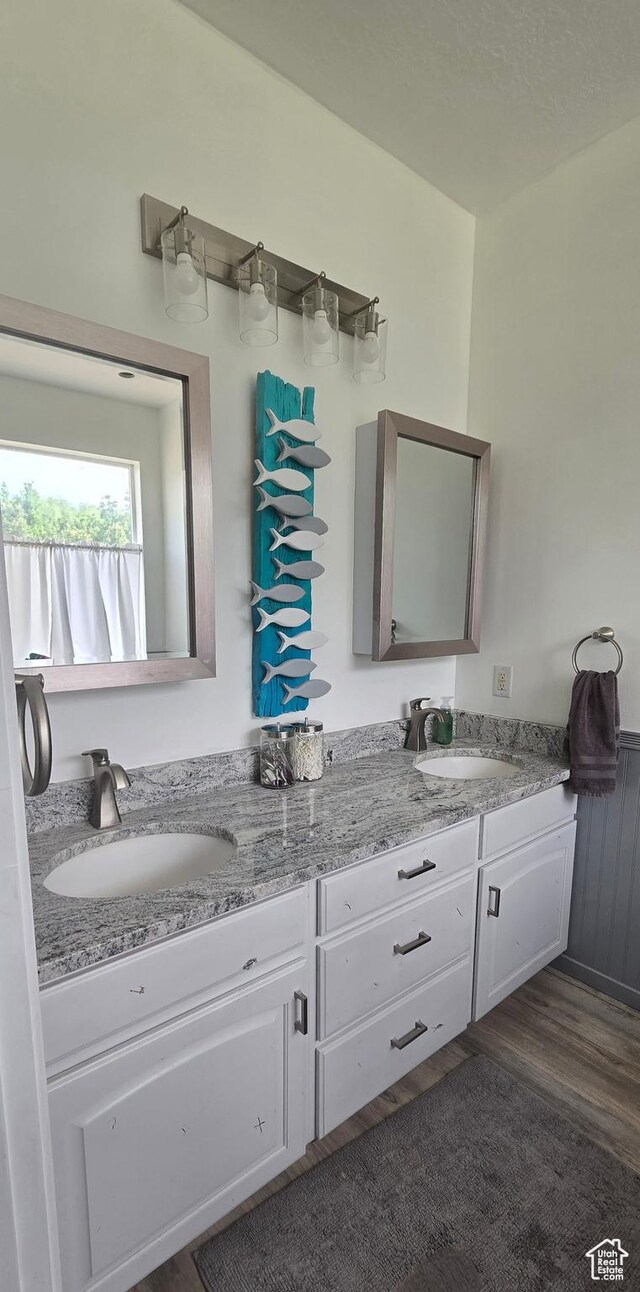 6897 S 4000 W, Benjamin, UT 84660 - bathroom featuring double vanity and wood finished floors