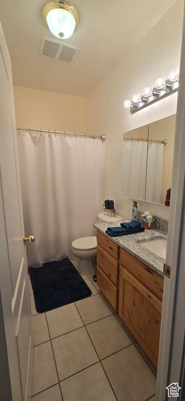 6897 S 4000 W, Benjamin, UT 84660 - bathroom featuring vanity, tile patterned flooring, toilet, and a shower with curtain