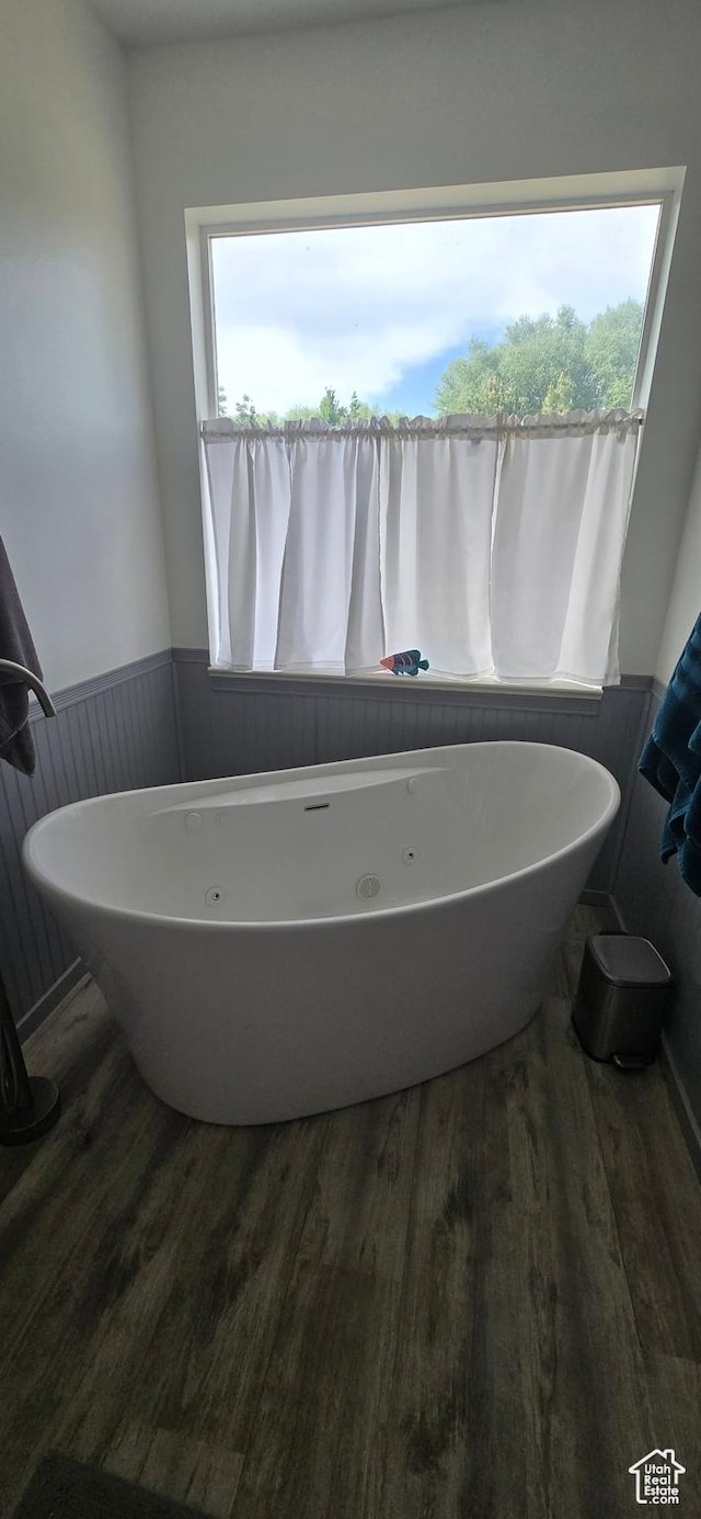 6897 S 4000 W, Benjamin, UT 84660 - bathroom featuring wood finished floors and a soaking tub