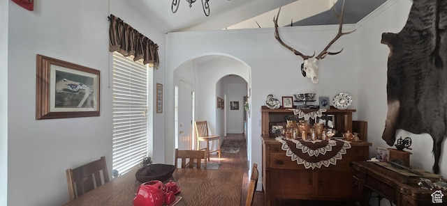 6897 S 4000 W, Benjamin, UT 84660 - dining space featuring arched walkways, a chandelier, wood finished floors, and high vaulted ceiling
