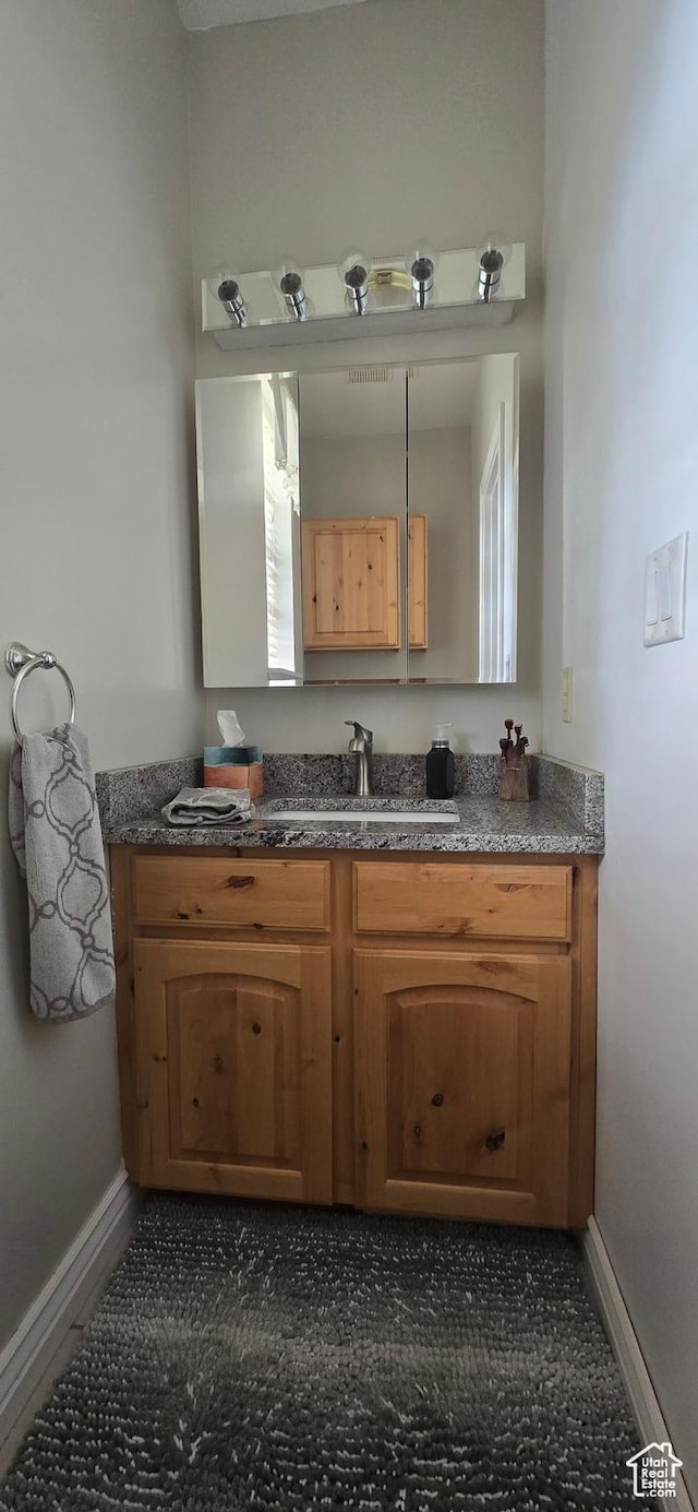 6897 S 4000 W, Benjamin, UT 84660 - bathroom with baseboards and vanity