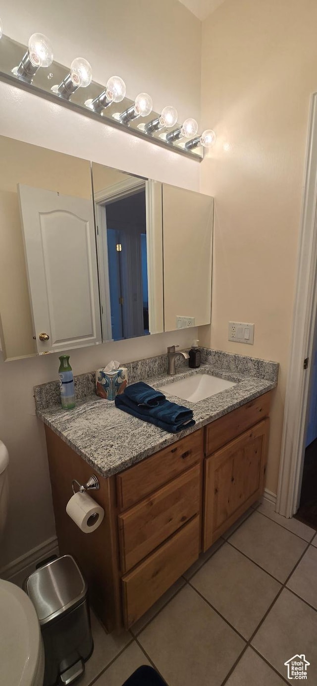 6897 S 4000 W, Benjamin, UT 84660 - bathroom featuring toilet, vanity, and tile patterned floors