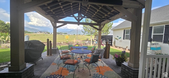 6897 S 4000 W, Benjamin, UT 84660 - view of patio featuring a gazebo, a mountain view, outdoor dining space, and a grill