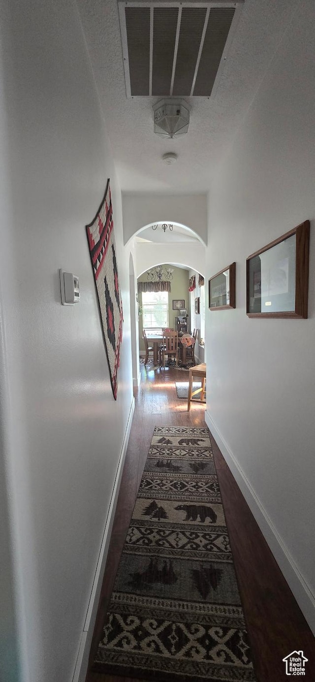 6897 S 4000 W, Benjamin, UT 84660 - hall with arched walkways, wood finished floors, and baseboards