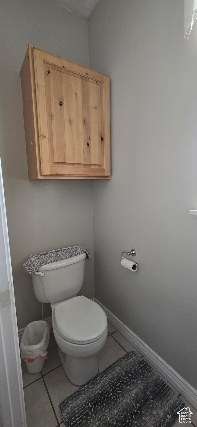 6897 S 4000 W, Benjamin, UT 84660 - bathroom with tile patterned floors, toilet, and baseboards