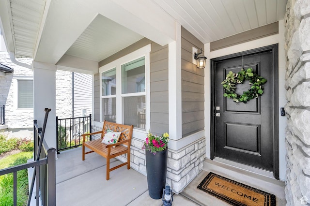 12297 S Boggs Way, Herriman, UT 84096 - doorway to property featuring stone siding and a porch