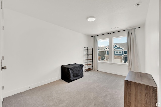 12297 S Boggs Way, Herriman, UT 84096 - unfurnished room featuring light carpet, baseboards, and a pendent fire sprinkler
