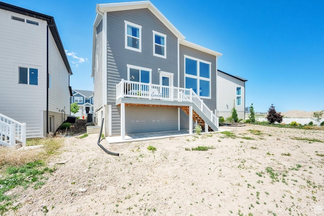 12297 S Boggs Way, Herriman, UT 84096 - view of front of house featuring stairway, a deck, and central air condition unit