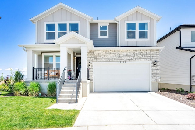 12297 S Boggs Way, Herriman, UT 84096 - craftsman-style home featuring board and batten siding, covered porch, an attached garage, driveway, and stone siding
