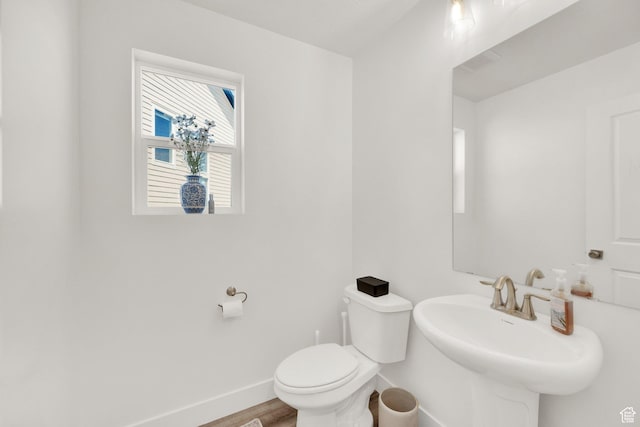 12297 S Boggs Way, Herriman, UT 84096 - bathroom with baseboards, toilet, wood finished floors, and a sink