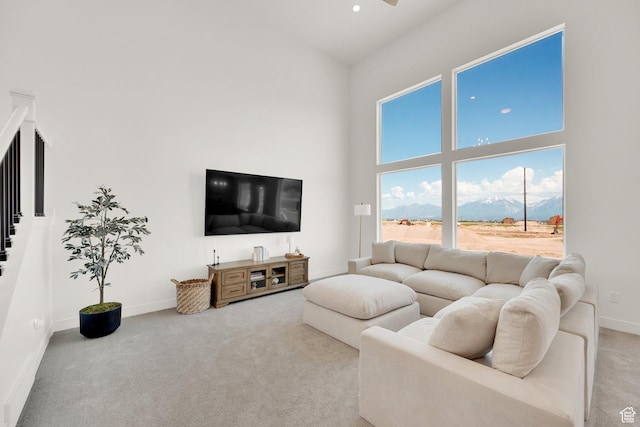 12297 S Boggs Way, Herriman, UT 84096 - living area with a high ceiling, light carpet, a ceiling fan, and baseboards