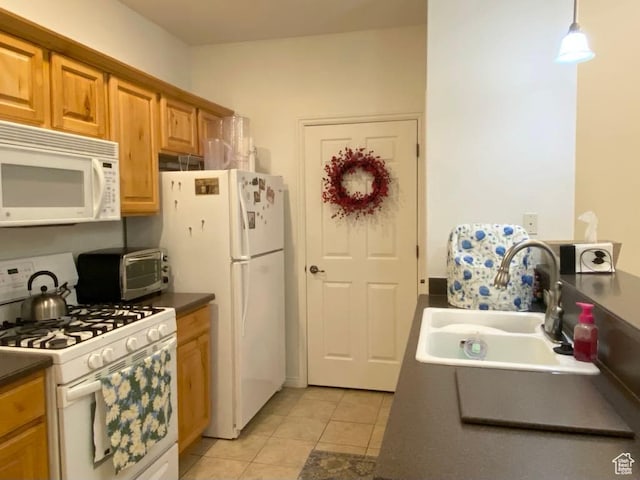 1052 S Canyon Meadows Dr Unit 4, Provo, UT 84606 - kitchen featuring white appliances, dark countertops, and light tile patterned floors