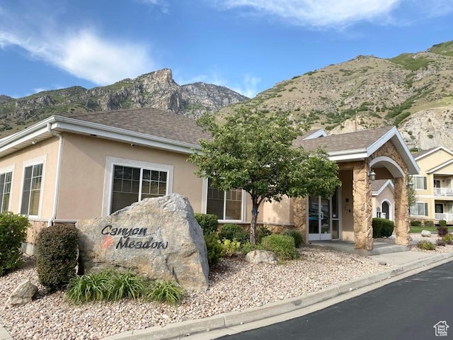 1052 S Canyon Meadows Dr Unit 4, Provo, UT 84606 - view of front of house with a mountain view, stucco siding, stone siding, and roof with shingles