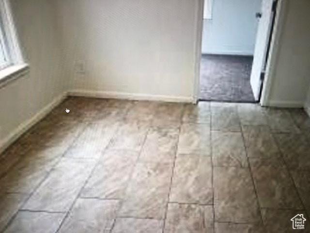 1419 S Grant, Ogden, UT 84404 - unfurnished dining area featuring baseboards