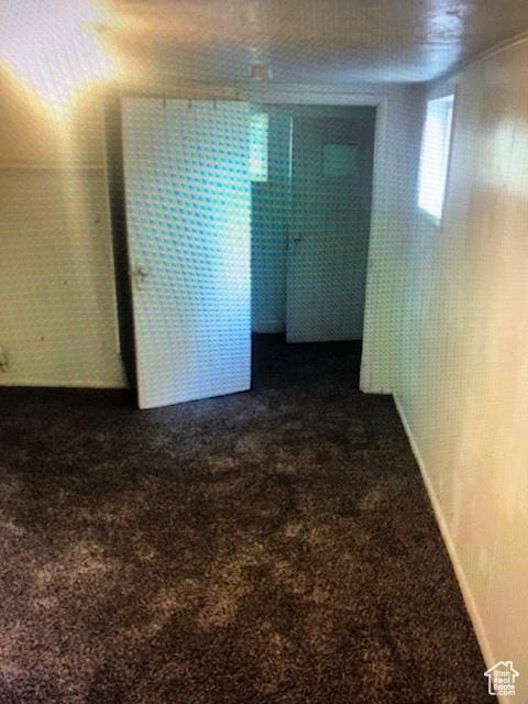 1419 S Grant, Ogden, UT 84404 - spare room featuring dark colored carpet and baseboards