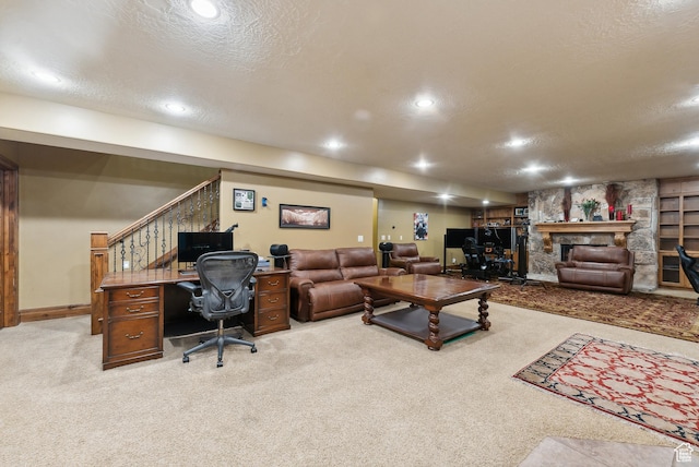 5964 S Ragsdale Dr E, Murray, UT 84121 - carpeted living room featuring a textured ceiling, a desk, a stone fireplace, and recessed lighting
